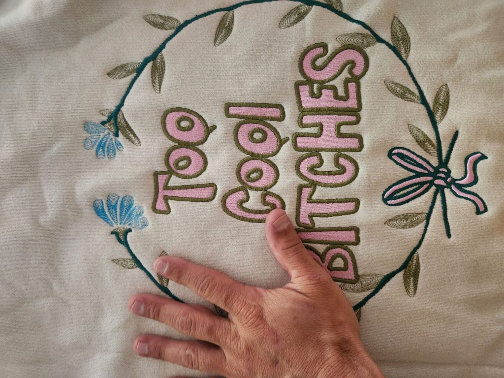 Close-up embroidery stitching on hoodie fabric