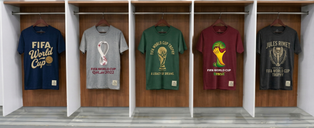 Branded FIFA World Cup inspired t-shirts featuring bold graphics, varied colorways, and woven labels displayed in a clean apparel setup