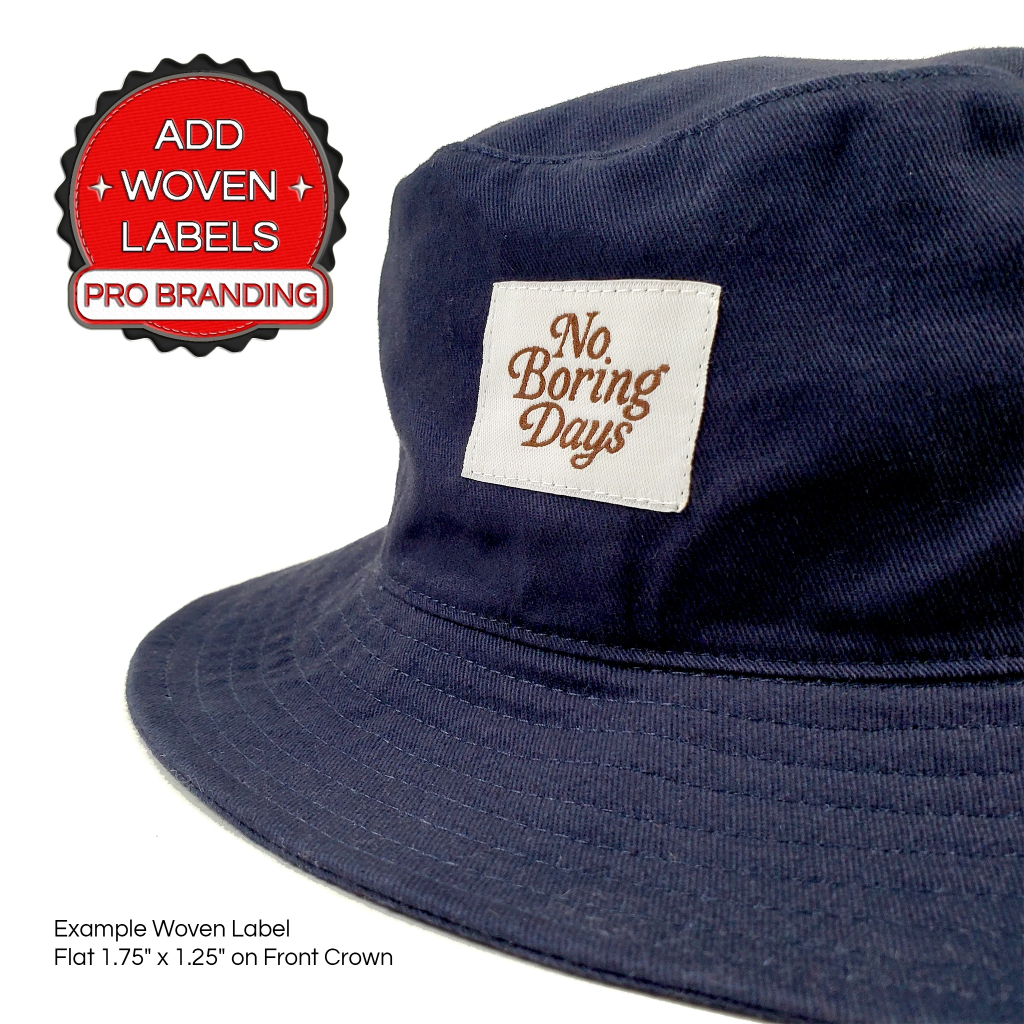 Navy faded bucket hat (1181) with “No Boring Days” label and “Add Woven Labels, Pro Branding” badge, casual and energetic style.